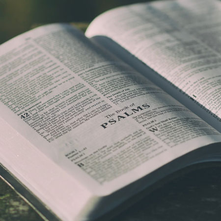 An open bible at the book of Psalms