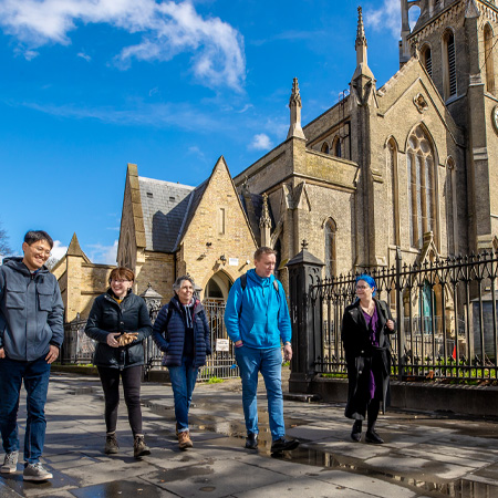 Bishop Guli walking outside a church